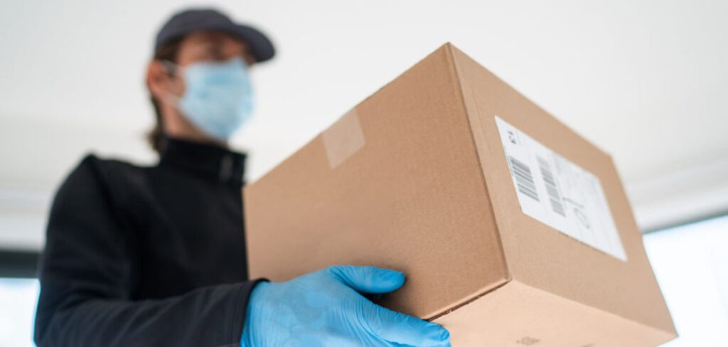 Delivery, Spare Parts, Performance (Photo of a courier delivering a package